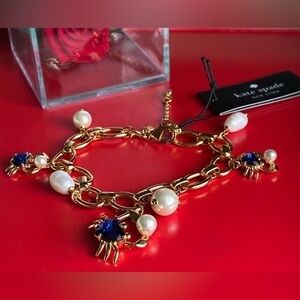 kate spade Gold-Tone Bracelet with Blue Crystal and Pearl Charms